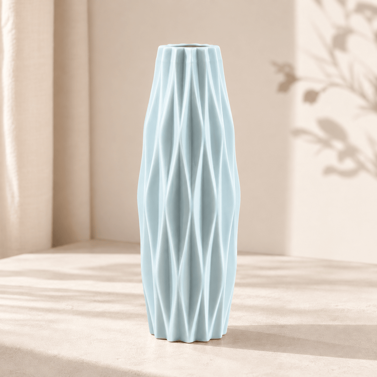 Facet - Diamond Pattern Faux Ceramic Vase — Light Blue in a clean warm-neutral product setting