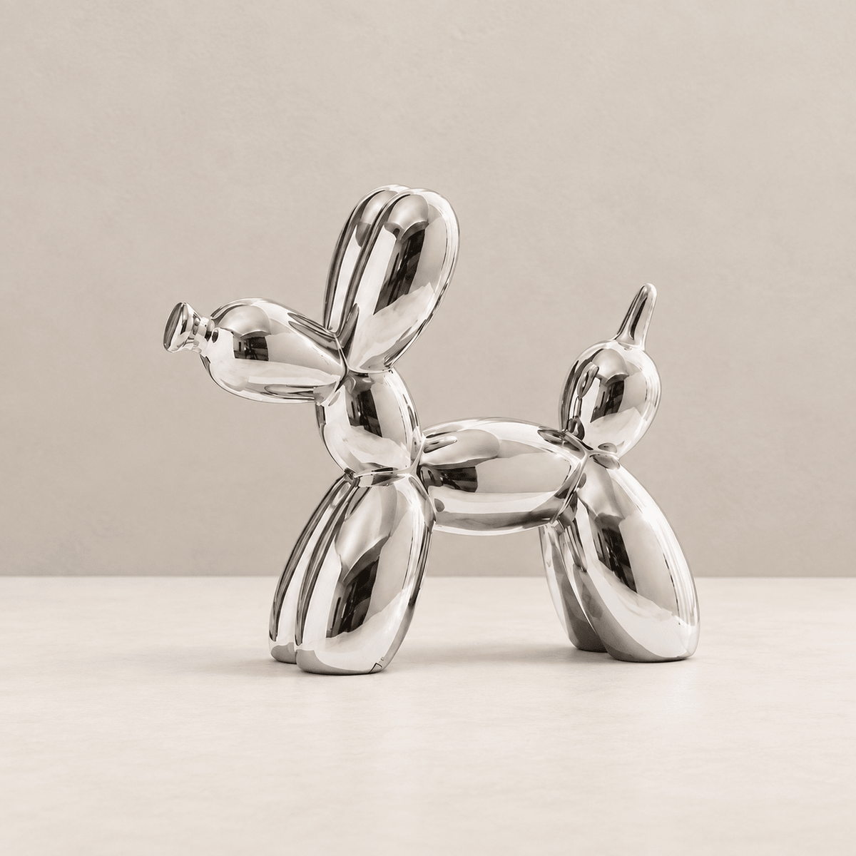 Art Deco Pup - Metallic Ceramic Balloon Dog Sculpture — Silver / Medium in a clean warm-neutral product setting