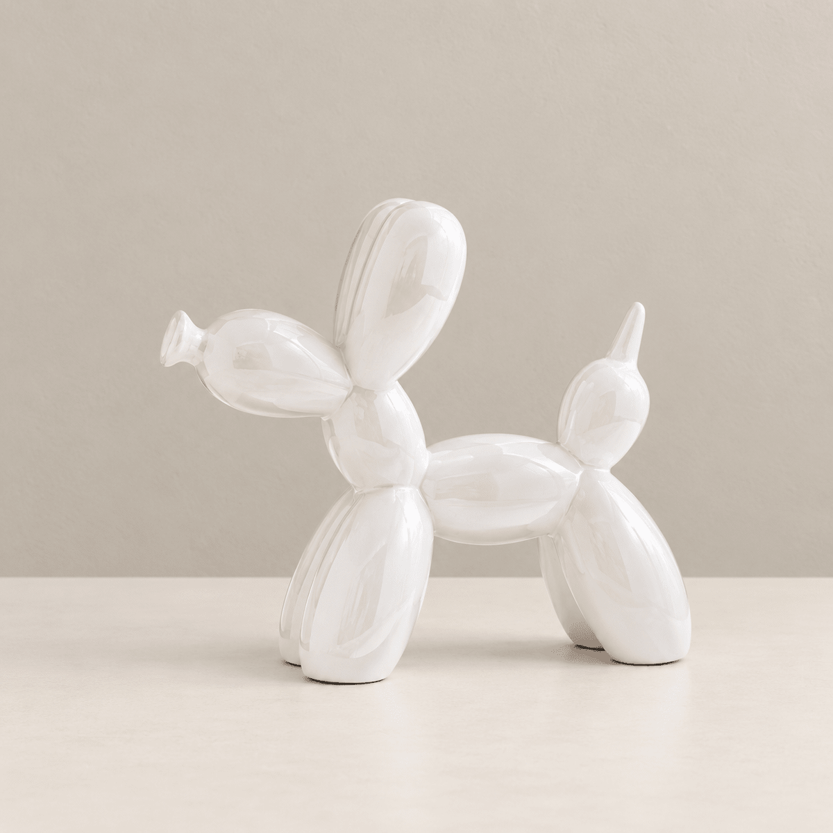 Art Deco Pup - Metallic Ceramic Balloon Dog Sculpture — Creamy White / Medium in a clean warm-neutral product setting