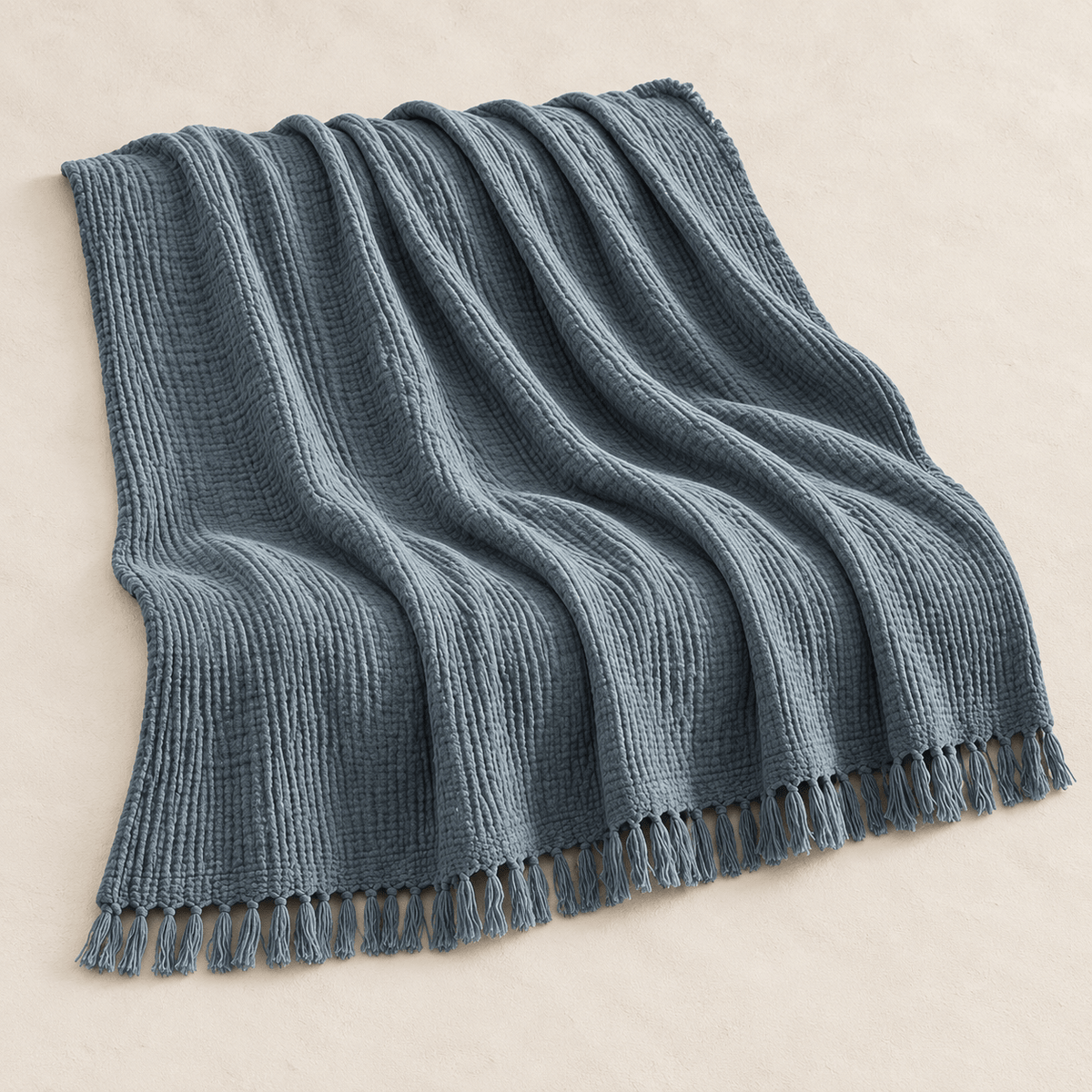 Mizu Fringe - Cotton Throw Blanket — Soot Blue / 51" × 67" in a clean warm-neutral product setting