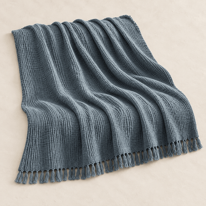 Mizu Fringe - Cotton Throw Blanket — Soot Blue / 51" × 67" in a clean warm-neutral product setting