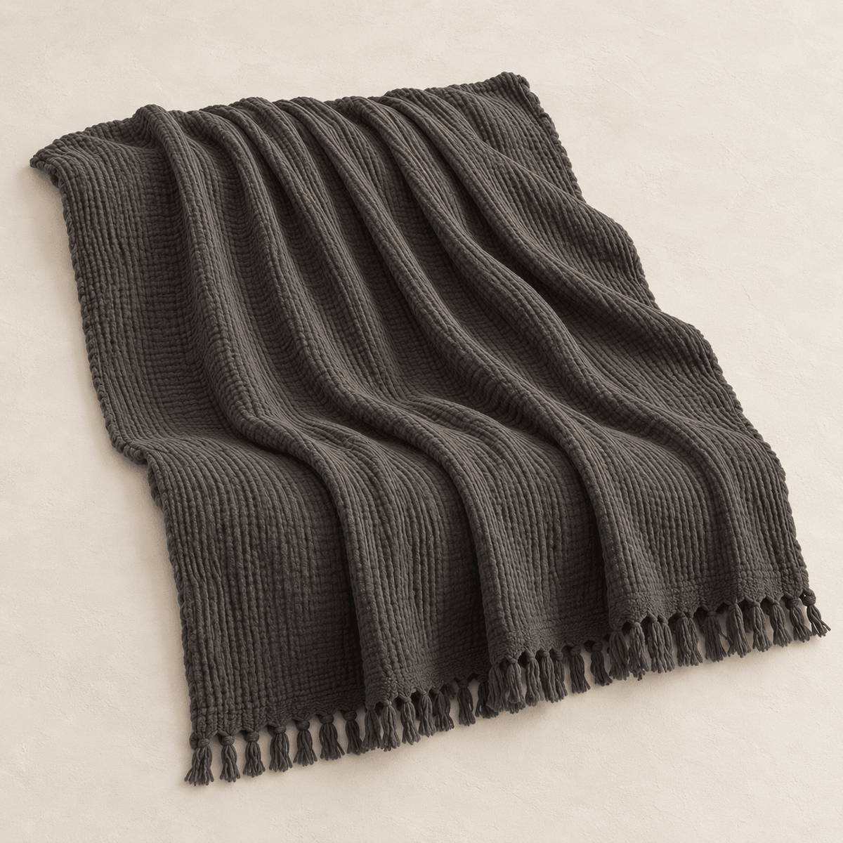 Mizu Fringe - Cotton Throw Blanket — Dull Grey / 51" × 67" in a clean warm-neutral product setting