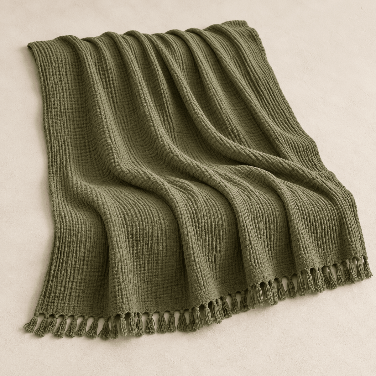 Mizu Fringe - Cotton Throw Blanket — Dark Green / 51" × 67" in a clean warm-neutral product setting