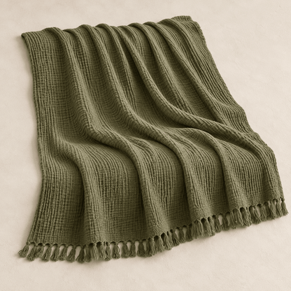 Mizu Fringe - Cotton Throw Blanket — Dark Green / 51" × 67" in a clean warm-neutral product setting